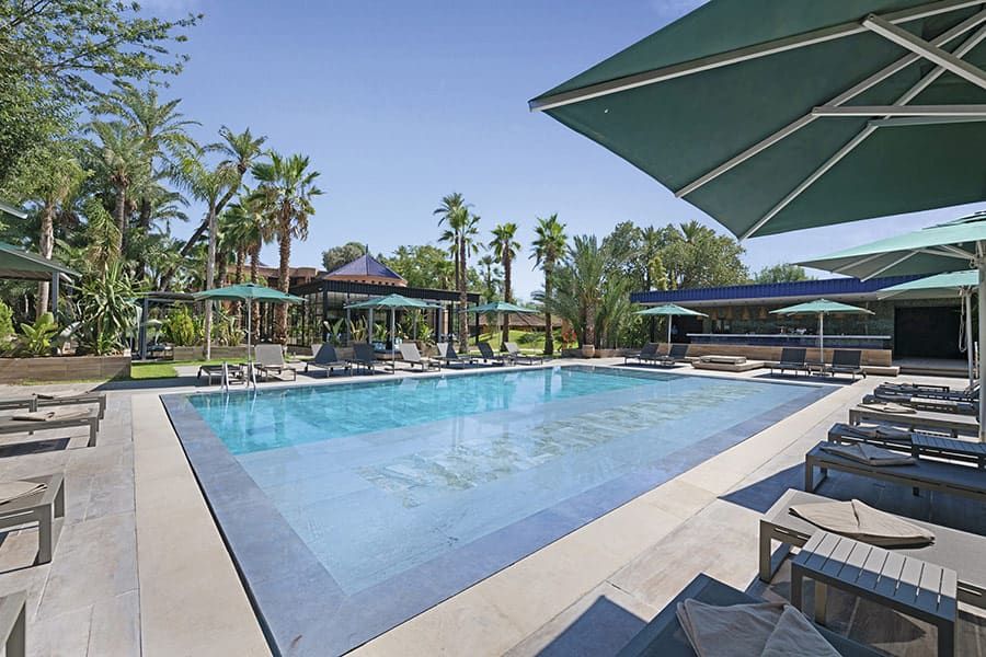 Swimming pool area at Hotel Riu Tikida Garden