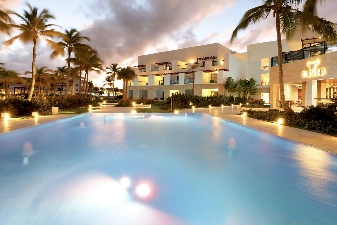 TRS Cap Cana suite balcony with hammock overlooking the Caribbean Sea and marina