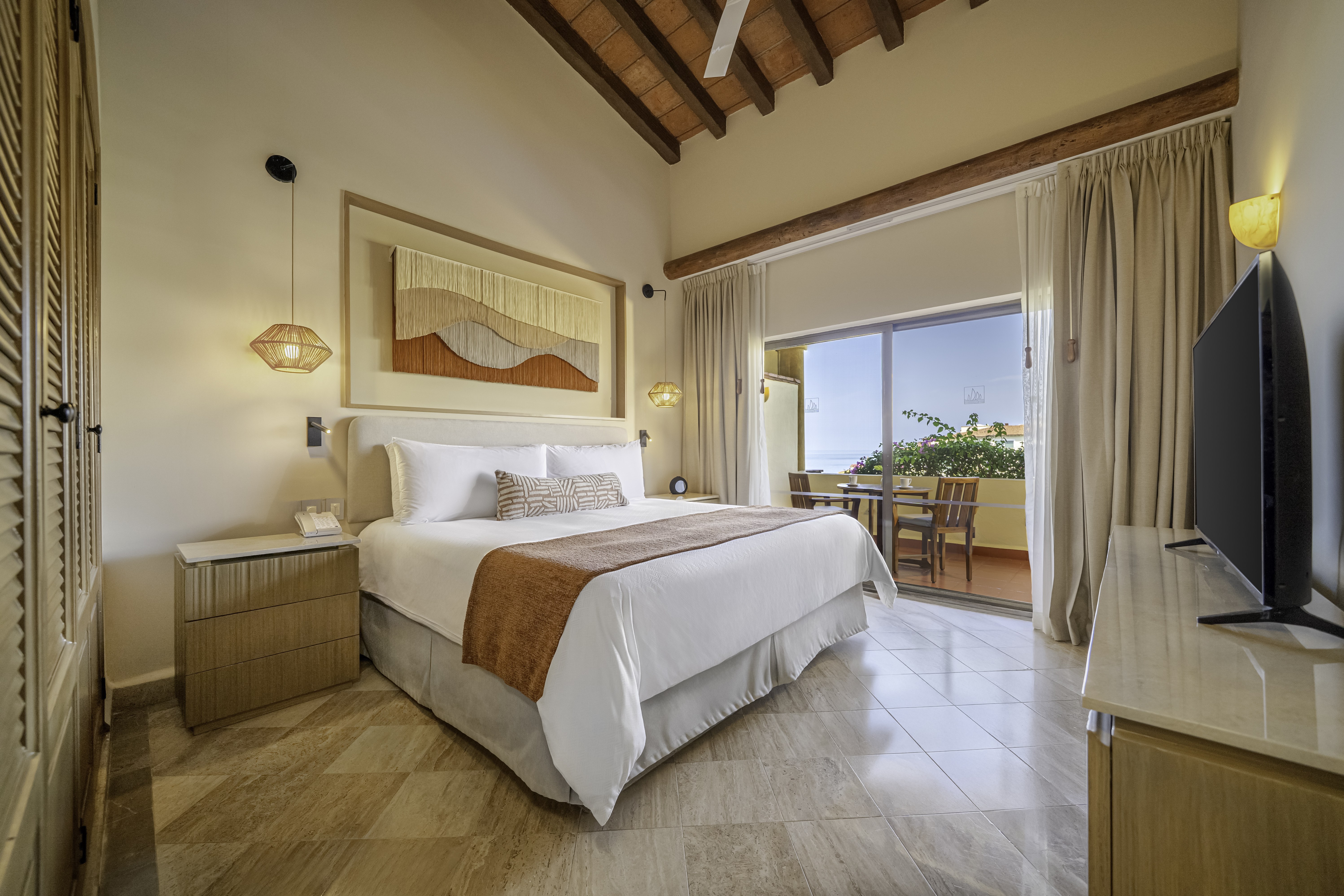 Deluxe One-Bedroom Suite with expanded living space and modern furnishings