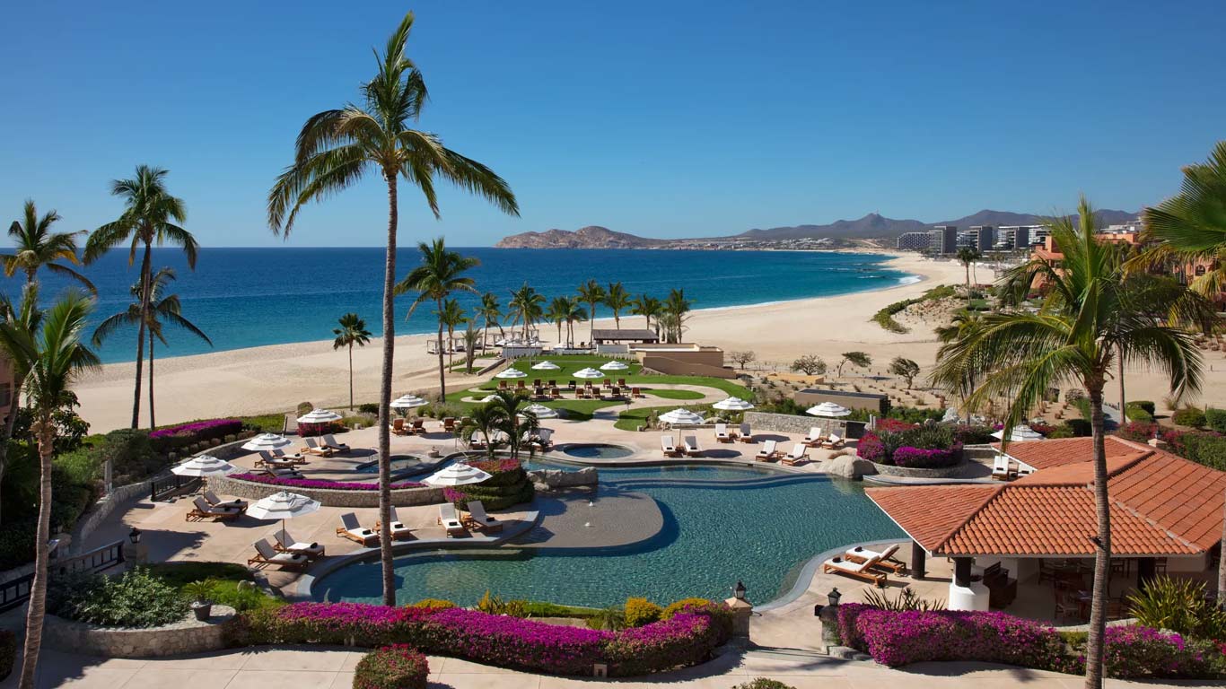 Spanish-colonial architecture with arched doorways and ocean views along the Tourist Corridor