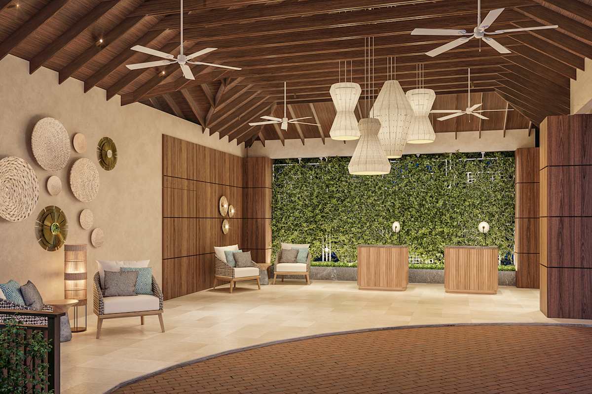 Resort lobby with contemporary Caribbean design, natural wood elements, and views of the tropical gardens